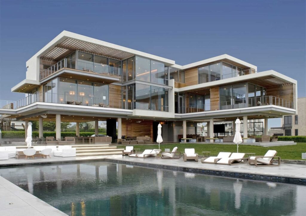 Modern home on 15ft stilts, made out of concrete and steel to survive the elements.